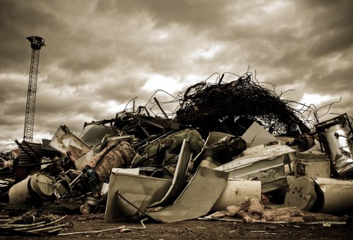 Operators separating recyclables and bulky items during a house clearance